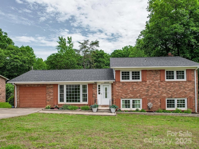 2666 Hill Ln, Gastonia, NC 28054 - tri-level home with a front lawn, brick siding, a shingled roof, and a chimney