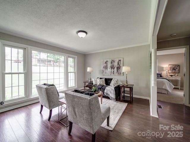 2666 Hill Ln, Gastonia, NC 28054 - living area with ornamental molding, dark wood-type flooring, a textured ceiling, and baseboards