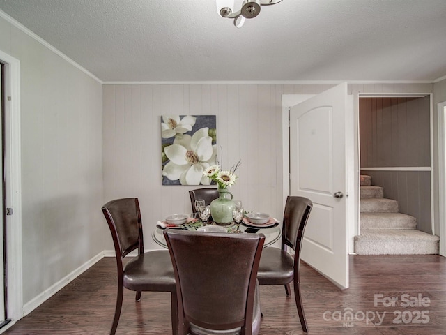 2666 Hill Ln, Gastonia, NC 28054 - dining area featuring crown molding, wood finished floors, stairs, a textured ceiling, and baseboards