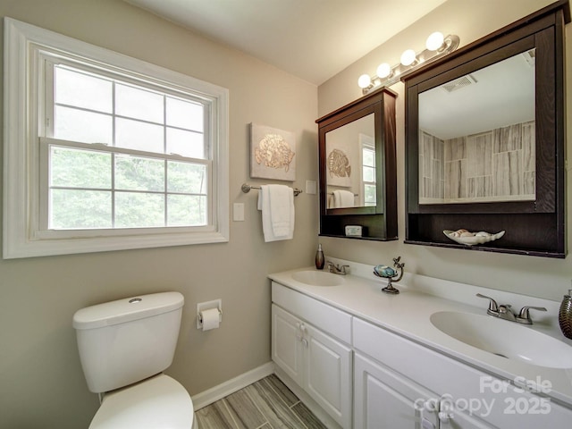 2666 Hill Ln, Gastonia, NC 28054 - full bathroom featuring toilet, baseboards, and double vanity