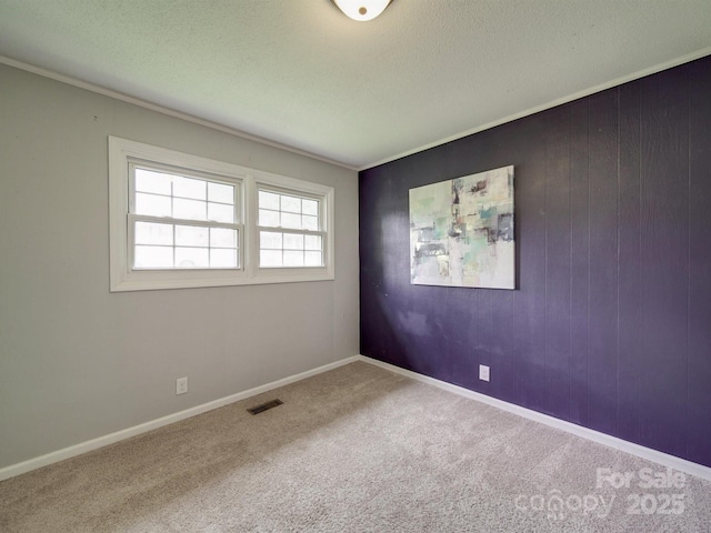 2666 Hill Ln, Gastonia, NC 28054 - carpeted spare room with a textured ceiling and ornamental molding