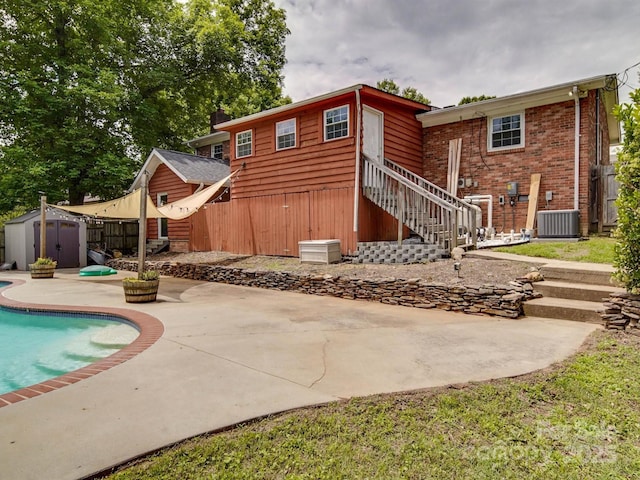 2666 Hill Ln, Gastonia, NC 28054 - rear view of house with a patio, stairs, brick siding, and central air condition unit