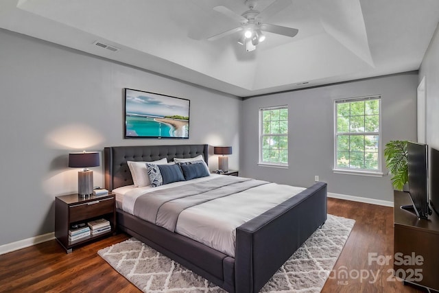 8120 Vermilion Dr, Charlotte, NC 28215 - bedroom with a raised ceiling, wood finished floors, and baseboards