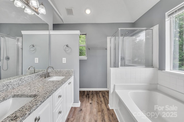 8120 Vermilion Dr, Charlotte, NC 28215 - bathroom with a garden tub, plenty of natural light, and double vanity