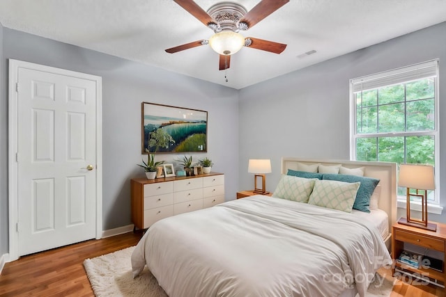 8120 Vermilion Dr, Charlotte, NC 28215 - bedroom featuring wood finished floors, baseboards, and ceiling fan