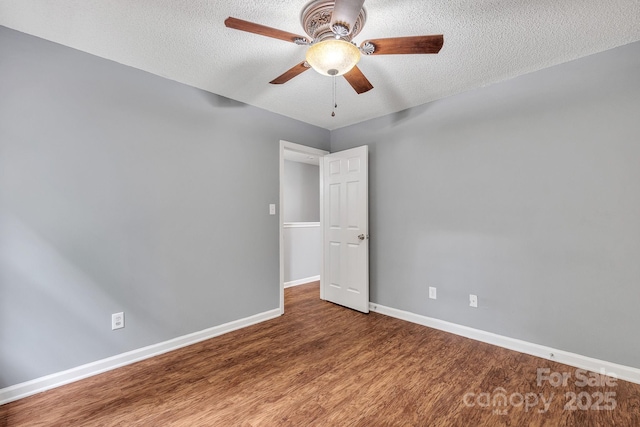8120 Vermilion Dr, Charlotte, NC 28215 - empty room featuring wood finished floors, ceiling fan, baseboards, and a textured ceiling