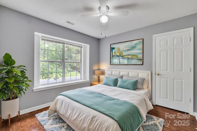 8120 Vermilion Dr, Charlotte, NC 28215 - bedroom with baseboards, ceiling fan, and wood finished floors