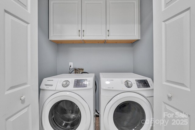 8120 Vermilion Dr, Charlotte, NC 28215 - laundry room featuring washing machine and clothes dryer and cabinet space