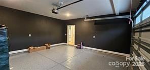 320 Lawrence Gray Rd, Charlotte, NC 28262 - garage featuring baseboards