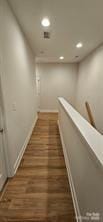 320 Lawrence Gray Rd, Charlotte, NC 28262 - corridor with recessed lighting, baseboards, wood finished floors, and an upstairs landing