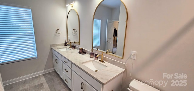 320 Lawrence Gray Rd, Charlotte, NC 28262 - bathroom featuring double vanity, toilet, and baseboards