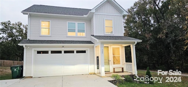 320 Lawrence Gray Rd, Charlotte, NC 28262 - view of front of house featuring driveway, an attached garage, board and batten siding, and roof with shingles