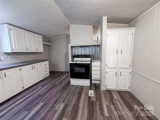 1145 Daniel Rd, Mocksville, NC 27028 - kitchen with electric range oven, white cabinetry, dark wood finished floors, a textured ceiling, and dark countertops