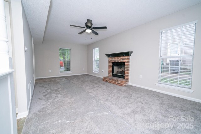 8125 Sheringham Way, Charlotte, NC 28227 - unfurnished living room with a ceiling fan, carpet floors, baseboards, and a brick fireplace