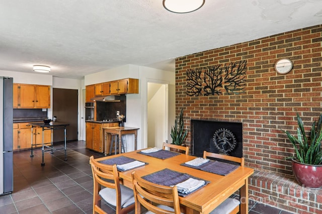 318 Old Leicester Hwy, Asheville, NC 28806 - dining area with a textured ceiling and dark tile patterned flooring