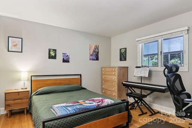 318 Old Leicester Hwy, Asheville, NC 28806 - bedroom featuring light wood-style floors and baseboards