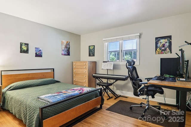 318 Old Leicester Hwy, Asheville, NC 28806 - bedroom with wood finished floors and an office area