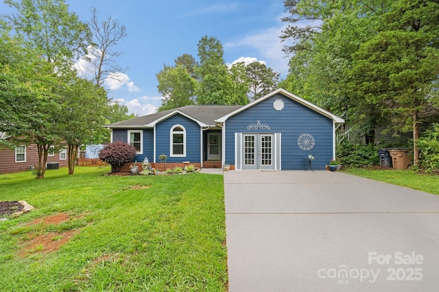 4810 Shea Ct, Monroe, NC 28110 - ranch-style home featuring french doors, a front lawn, and concrete driveway