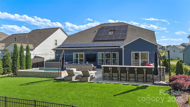 5050 Havencrest Dr, Fort Mill, SC 29715 - rear view of property featuring a patio area, an outdoor hangout area, roof mounted solar panels, and a pool