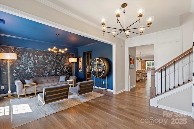 5050 Havencrest Dr, Fort Mill, SC 29715 - living room featuring a chandelier, wood finished floors, stairway, ornamental molding, and baseboards