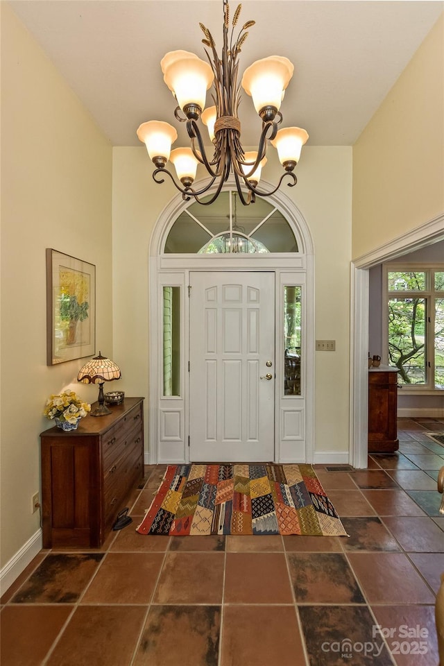 25 Windsong Dr, Fairview, NC 28730 - entryway featuring a chandelier, baseboards, and a high ceiling