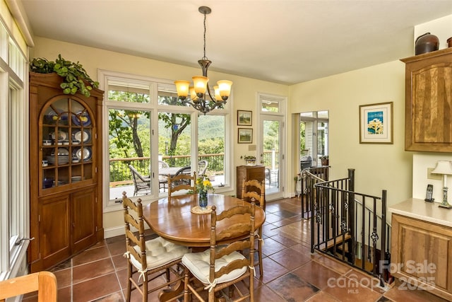 25 Windsong Dr, Fairview, NC 28730 - dining room with plenty of natural light, a chandelier, and dark tile patterned flooring