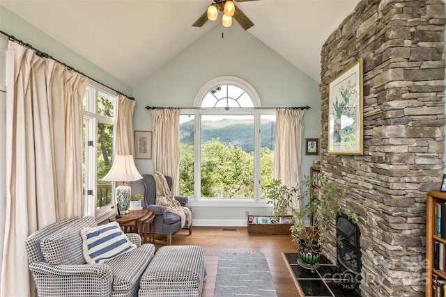25 Windsong Dr, Fairview, NC 28730 - sitting room featuring ceiling fan, wood finished floors, high vaulted ceiling, and a fireplace
