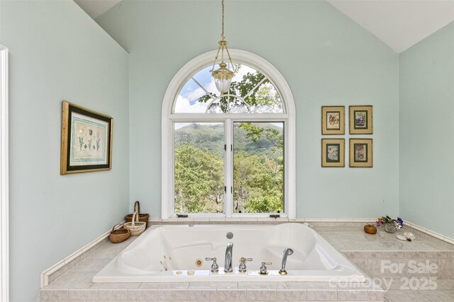 25 Windsong Dr, Fairview, NC 28730 - full bathroom with vaulted ceiling and a whirlpool tub