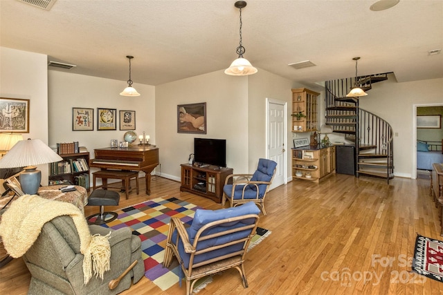 25 Windsong Dr, Fairview, NC 28730 - living area featuring light wood-type flooring, stairway, and baseboards