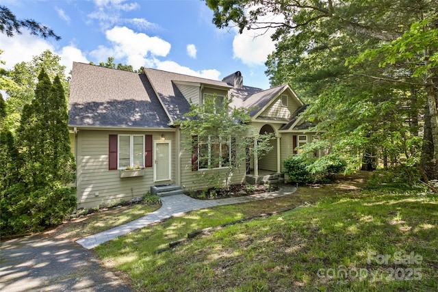 25 Windsong Dr, Fairview, NC 28730 - view of front of property with roof with shingles, a front yard, a chimney, and entry steps