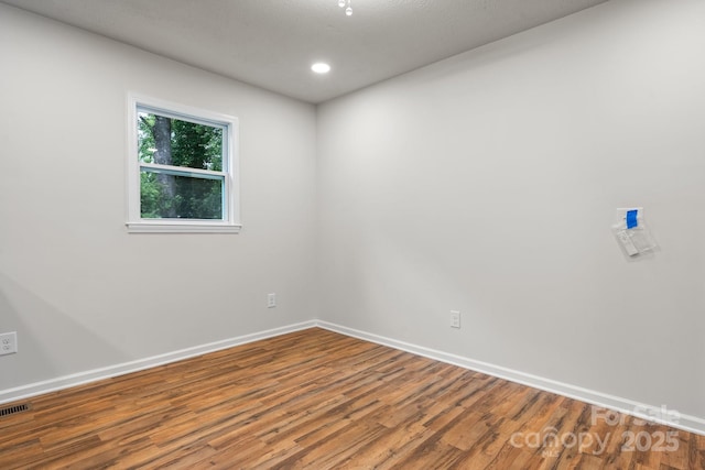 520 Hickory Ave, Hudson, NC 28638 - empty room featuring wood finished floors, baseboards, and recessed lighting