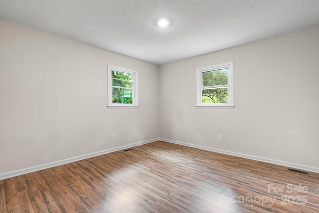 520 Hickory Ave, Hudson, NC 28638 - spare room featuring baseboards, wood finished floors, and recessed lighting