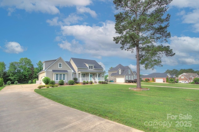 1327 Springlake Rd, York, SC 29745 - view of front facade with concrete driveway, a porch, board and batten siding, and a front yard