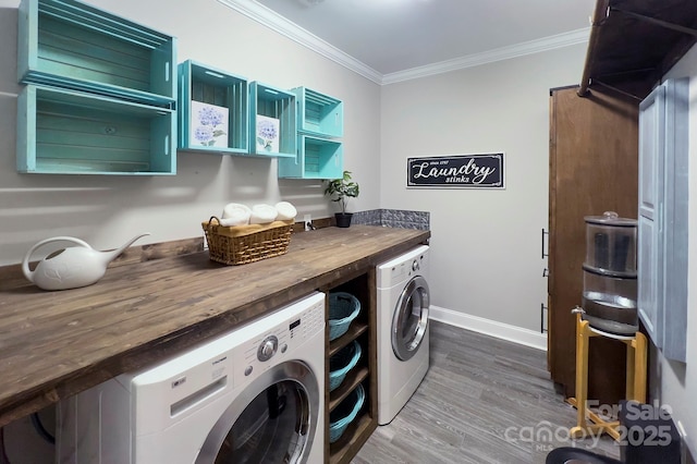 1327 Springlake Rd, York, SC 29745 - laundry room with ornamental molding, washing machine and dryer, wood finished floors, and baseboards