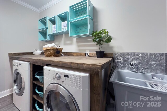 1327 Springlake Rd, York, SC 29745 - laundry area with washer and clothes dryer, ornamental molding, and wood finished floors