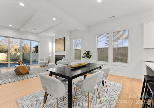 5615 Lantana Ave Unit B, Charlotte, NC 28205 - dining room featuring recessed lighting, healthy amount of natural light, light wood finished floors, a fireplace, and beam ceiling