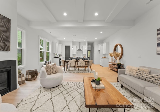 5615 Lantana Ave Unit B, Charlotte, NC 28205 - living room with beam ceiling, light wood-style flooring, recessed lighting, and a glass covered fireplace