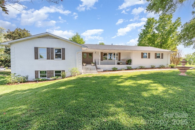 1041 Brawley School Rd, Mooresville, NC 28117 - view of front of home featuring brick siding, a front lawn, and a porch