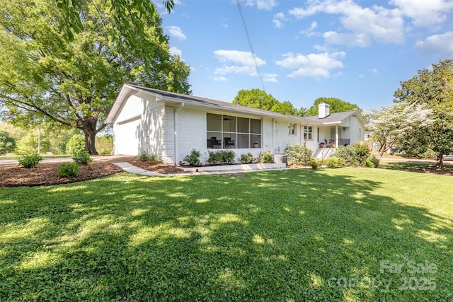 1041 Brawley School Rd, Mooresville, NC 28117 - ranch-style home featuring brick siding, a front lawn, a garage, and a chimney