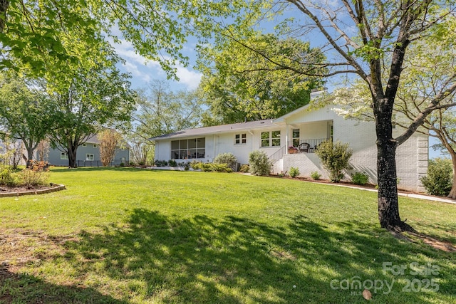 1041 Brawley School Rd, Mooresville, NC 28117 - view of front of property featuring a front lawn, a chimney, and brick siding