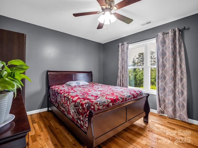 2301 Saratoga Run, Morganton, NC 28655 - bedroom with baseboards, wood finished floors, and a ceiling fan
