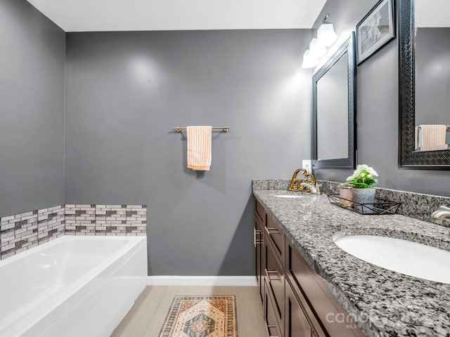 2301 Saratoga Run, Morganton, NC 28655 - full bathroom featuring double vanity, baseboards, and a bath