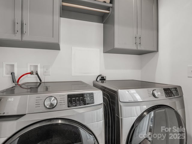 2301 Saratoga Run, Morganton, NC 28655 - laundry area featuring cabinet space and washer and dryer