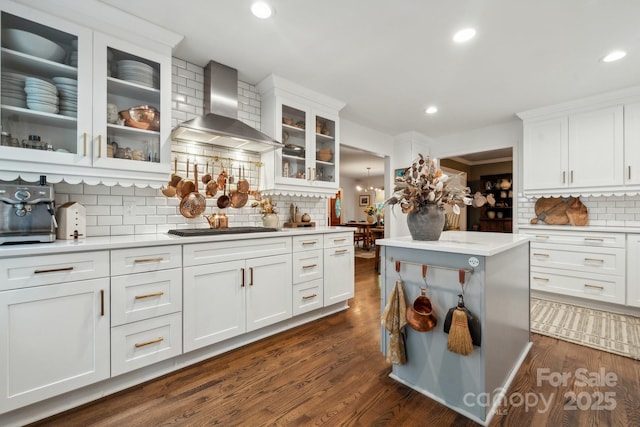 2507 Connemara Dr, Matthews, NC 28105 - kitchen featuring wall chimney exhaust hood, decorative backsplash, gas cooktop, light countertops, and white cabinets