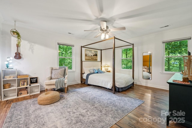 2507 Connemara Dr, Matthews, NC 28105 - bedroom with crown molding, wood finished floors, baseboards, and ceiling fan