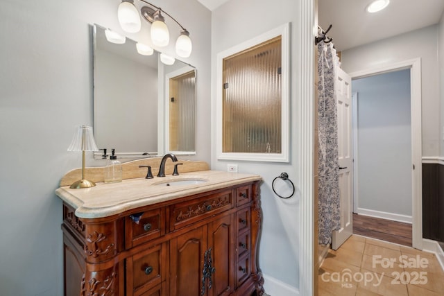 2507 Connemara Dr, Matthews, NC 28105 - bathroom featuring vanity, tile patterned flooring, and baseboards