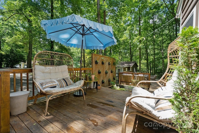 2507 Connemara Dr, Matthews, NC 28105 - wooden deck with an outbuilding and view of scattered trees