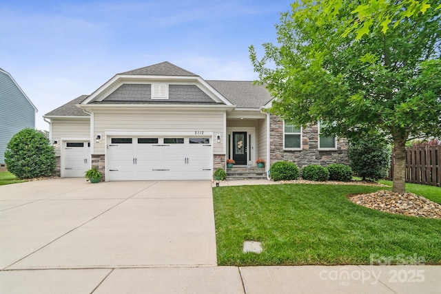 2112 Balting Glass Dr, Indian Trail, NC 28079 - craftsman house featuring an attached garage, stone siding, concrete driveway, and roof with shingles