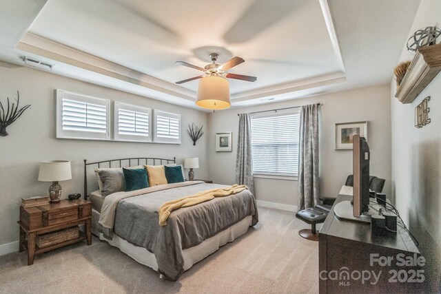 2112 Balting Glass Dr, Indian Trail, NC 28079 - carpeted bedroom with a tray ceiling and baseboards