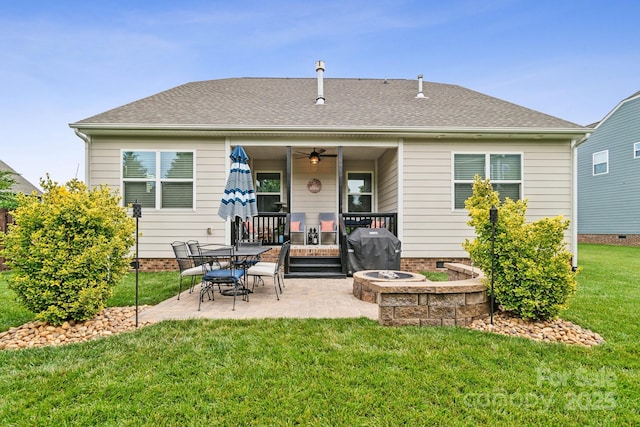 2112 Balting Glass Dr, Indian Trail, NC 28079 - back of property with a patio, a yard, a ceiling fan, and an outdoor fire pit